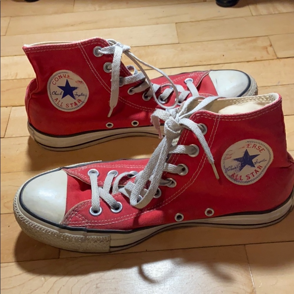 Red high top Chuck Taylor converse